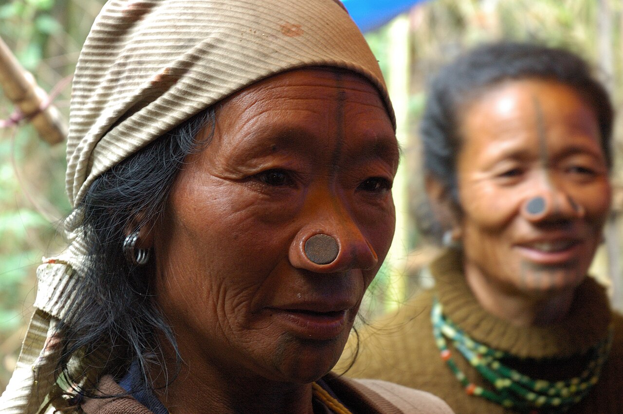 Apatani women at a wedding in Hija, wearing facial tattoos and nose plugs